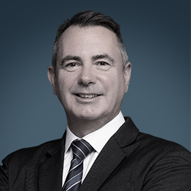 Lee Talbott – Senior Director, ROSHN Group | RLC Global Forum Professional portrait of Lee Talbott, Senior Director, Retail Portfolio at ROSHN Group, wearing a dark suit and tie with a confident expression.