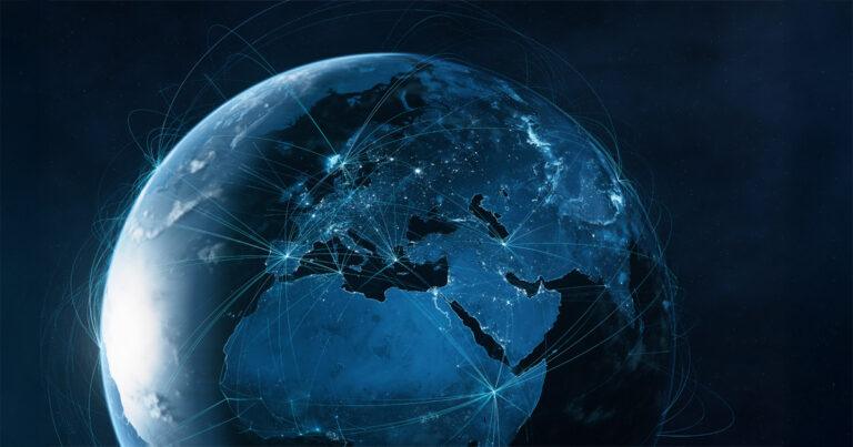 Digital rendering of earth at night, showing with glowing city lights and a network of blue connection lines.