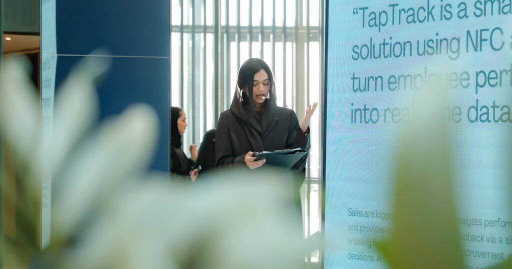 Presenter of the NextGen Retail Challenge stands on stage