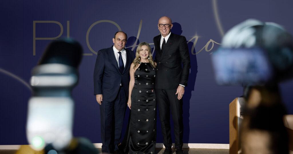 Marco Bizzarri, Ingie Chalhoub and Panos Linardos standing before a dark blue RLC Honors backdrop.