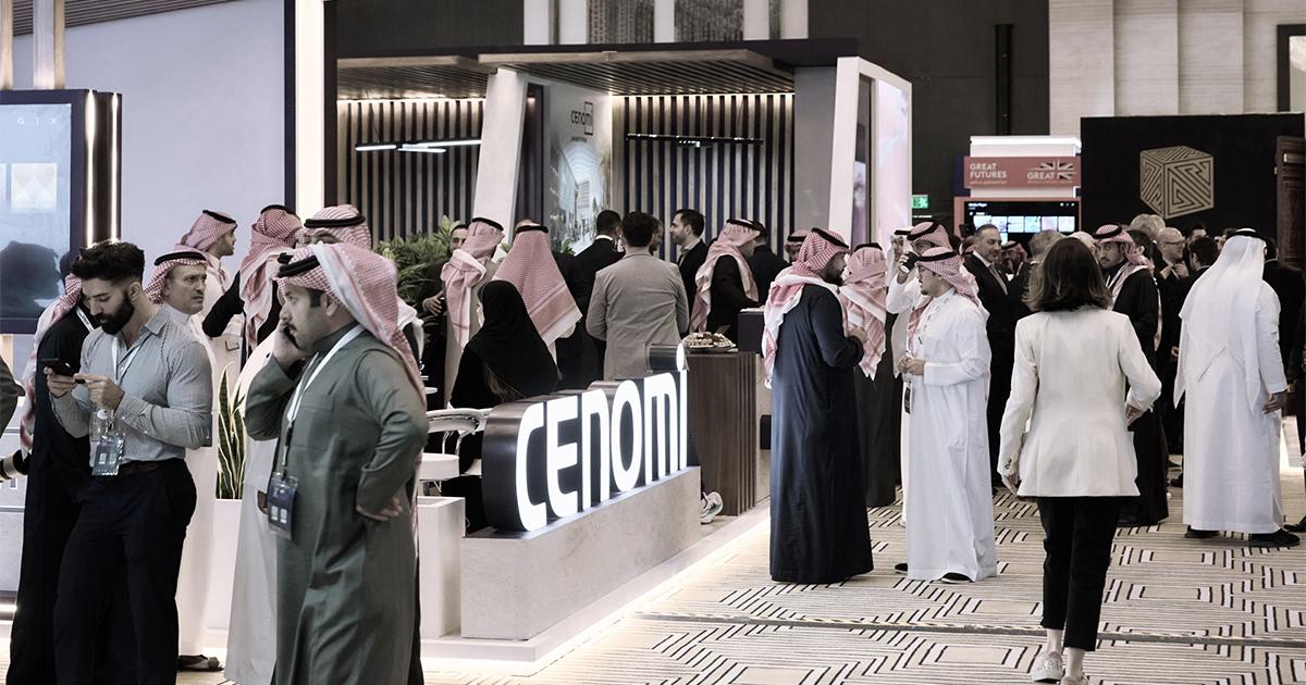 Photo of a group of people networking outside the Plenary Hall at the RLC Global Forum.